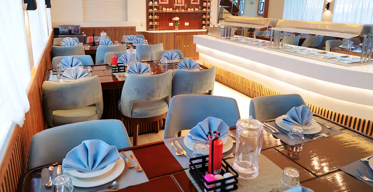 Seawolf dining area with table settings and sea view