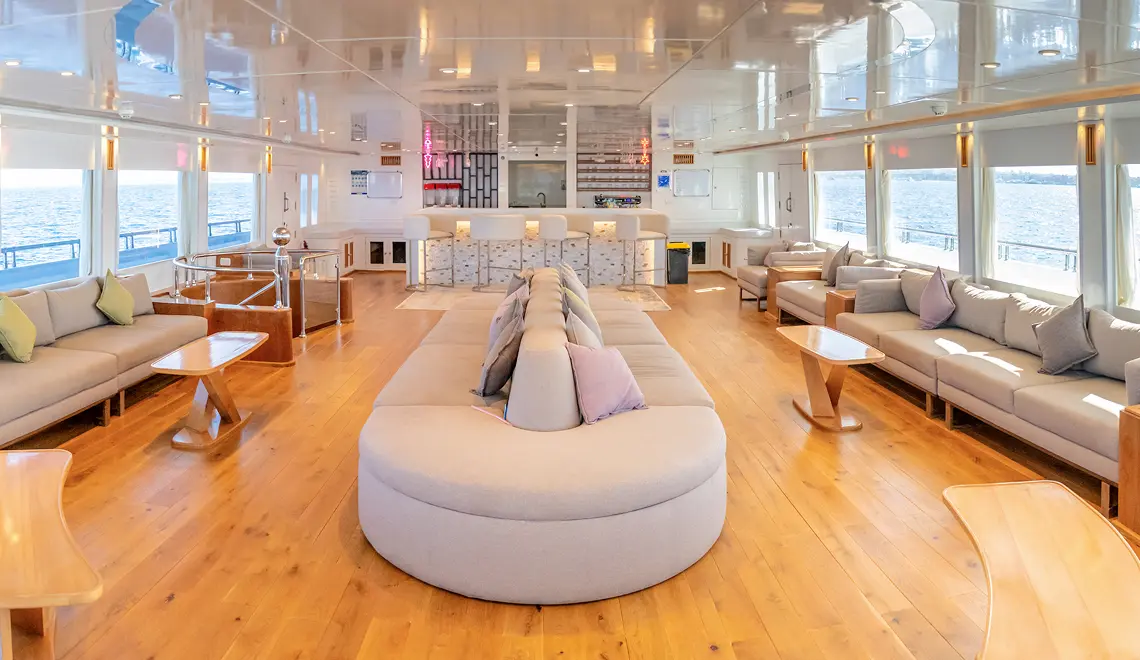 Indoor salon with seating and sea view